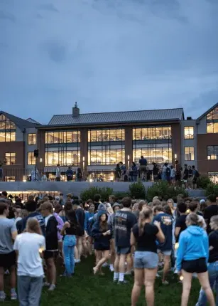 Students gather on the Commons lawn at First Night 2024