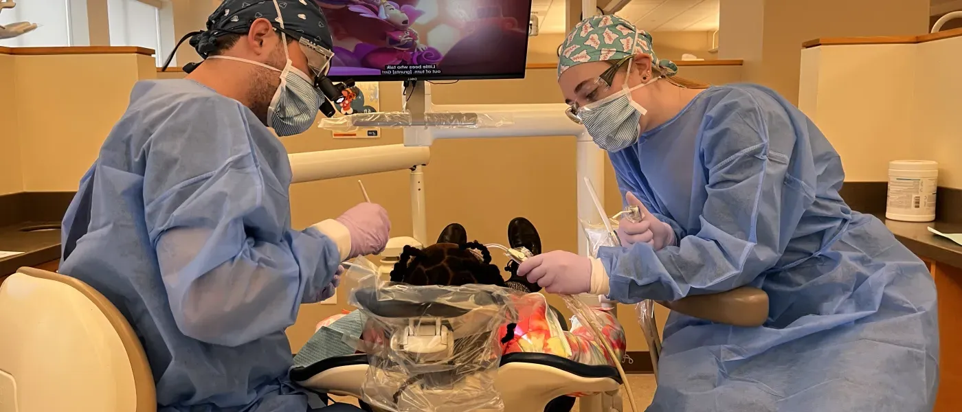 Dental students perform cleanings for children at the Oral Health Center's dental clinic